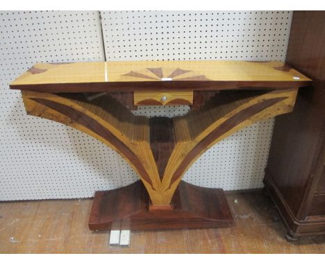 AN ART DECO STYLE WALNUT AND ROSEWOOD SIDE TABLE of rectangular form the shaped moulded top with frieze drawer raised on a sh