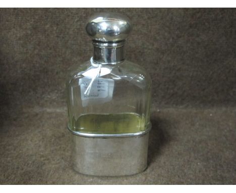 A SILVER AND GLAZED HIP FLASK London inscribed "LSA"