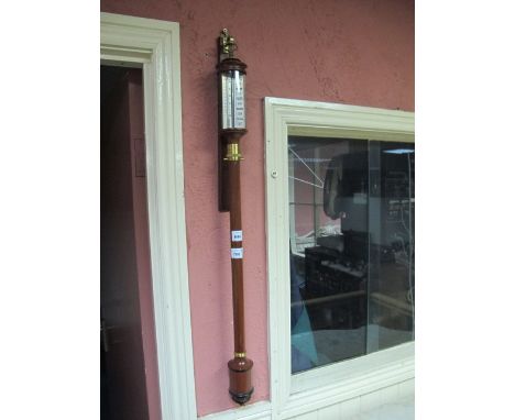 A GOOD WALNUT AND BRASS MOUNTED BAROMETER AND THERMOMETER of cylindrical form 93cm (h)