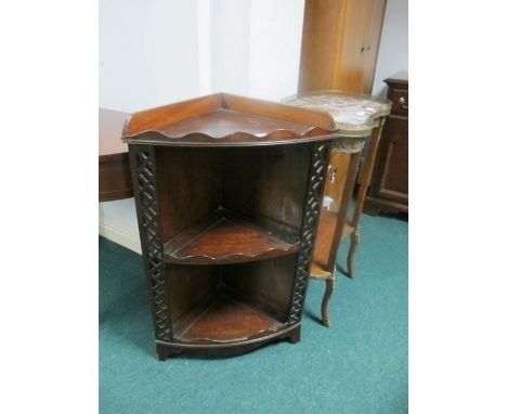 A MAHOGANY CORNER SHELF 19th Century with moulded gallery above two open shelves between pierced uprights on bracket feet 84c