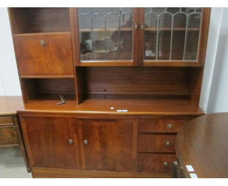 A MAHOGANY WALL CABINET the super structure with lead glass panel doors with hinged compartment above an open shelf the base 