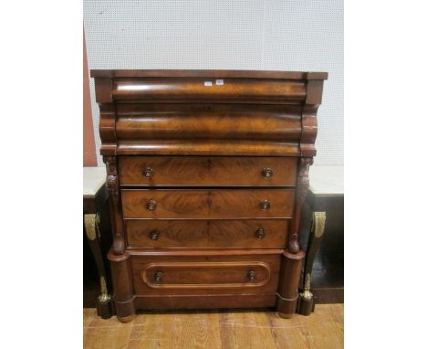 A GOOD VICTORIAN MAHOGANY SCOTCH CHEST of inverted breakfront outline the shaped moulded top above six long graduated drawers