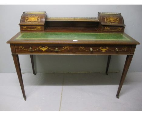 A FINE EDWARDIAN MAHOGANY SATINWOOD INLAID WRITING TABLE surmounted with a moulded shelf with pierced brass gallery flanked o