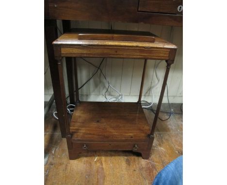 A GEORGIAN MAHOGANY OCCASIONAL TABLE the rectangular moulded top above an open shelf with frieze drawer joined by cylindrical