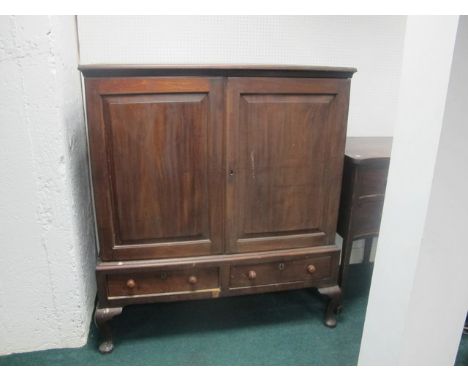 A GEORGIAN MAHOGANY LINEN CUPBOARD the rectangular top above a pair of panelled doors containing a slide tray the base with t