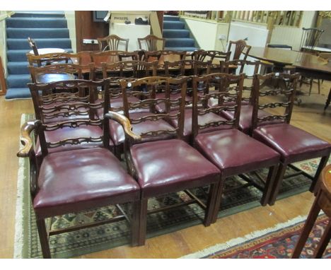 A GOOD SET OF TWELVE CHINESE CHIPPENDALE STYLE DINING CHAIRS each with a pierced ladder back above a hide upholstered seat on