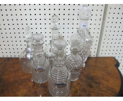 THREE EARLY WATERFORD HOB NAIL CUT DECANTERS with stoppers together with a Waterford cut glass decanter and two glass decante