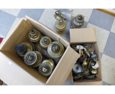Assorted brass oil lamp parts and a brass wall light 
