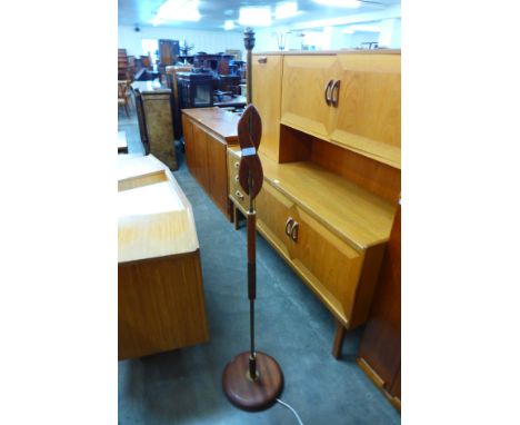 A teak standard lamp 