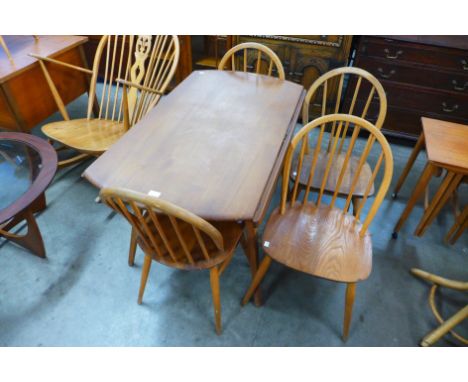 An Ercol Blonde drop-leaf table and four chairs