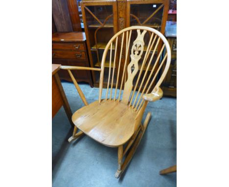 An Ercol blonde rocking chair 