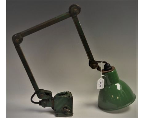 A mid 20th century industrial machinist lamp with green enamel shade