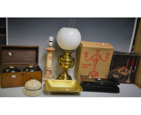 A pair of crown green bowls in oak carry case; an onyx table lamp; a set of Waymaster scales with weights; a Duplex oil lamp;