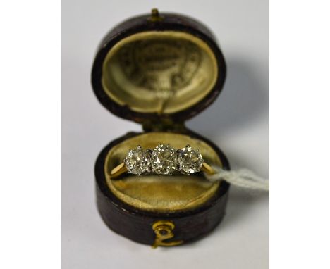 A diamond trilogy ring, linear set with three cushion and round old cut diamonds, estimated total diamond weight approx 1.50c