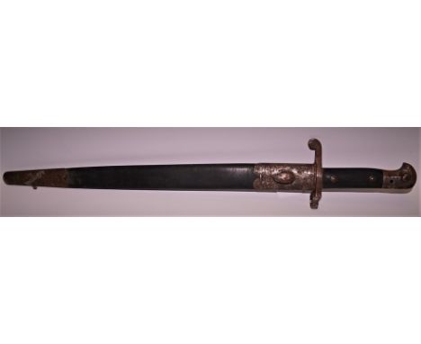 A late 19th century Wilkinson's Sword Company Sword Bayonet and scabbard, VR marks, No 89, WD arrow to blade, checkered grip,
