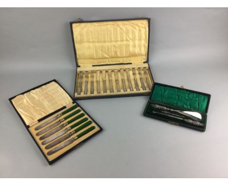 SET OF SIX SILVER HANDLED KNIVES AND FORKS, in fitted case, along with two royal commemorative silver napkin rings, each case