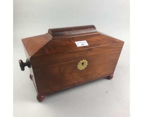 VICTORIAN MAHOGANY SARCOPHAGUS TEA CADDY, the hinged cover within double handles, on later ball feet, 36cm wide