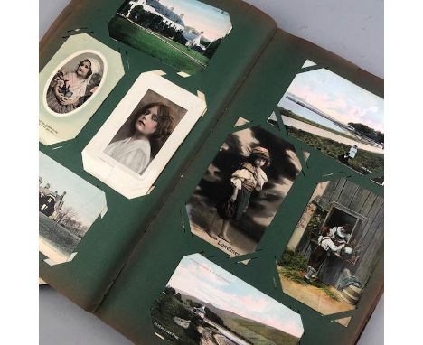 ALBUM OF VINTAGE POSTCARDS, landscape, glamour and comedy, contained in a floral decorated cloth album
