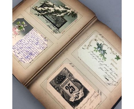 ALBUM OF VINTAGE POSTCARDS, including U.K. and European examples, contained in a cloth album decorated with a young lady