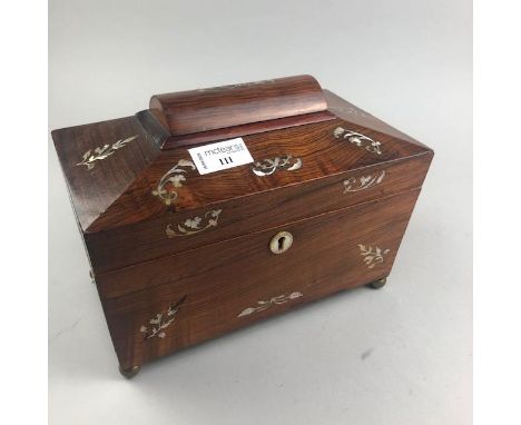 VICTORIAN ROSEWOOD SARCOPHAGUS TEA CADDY, inlaid with mother of pearl, on brass ball feet, 25.5cm wide