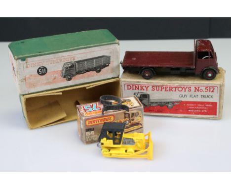 Boxed play worn Dinky Supertoys No 512 Guy Flat Truck diecast model in maroon, a boxed Matchbox 64 Caterpillar D-9 Tractor (d