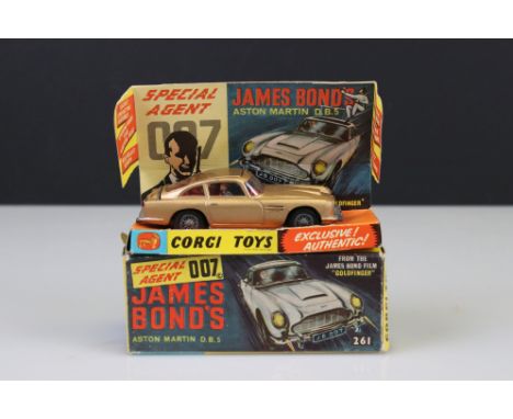 Boxed Corgi 261 James Bond Aston Martin DB5 diecast model with ejector figure, some paint chips but diecast vg overall, parts