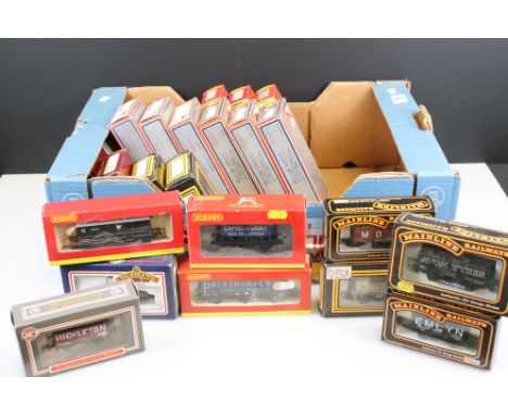 28 Boxed OO gauge items of rolling stock to include wagons and vans featuring 6 x Hornby, 7 x Mainline, 6 x Lima, 6 x Dapol, 
