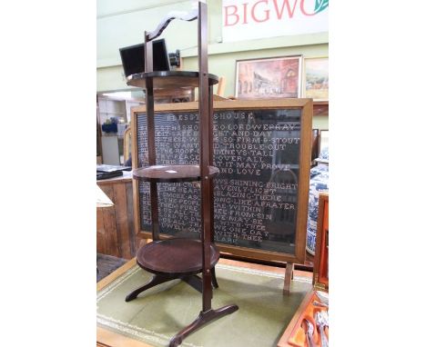 A folding mahogany three tier stand with a glazed framed fire screen with tapestry 