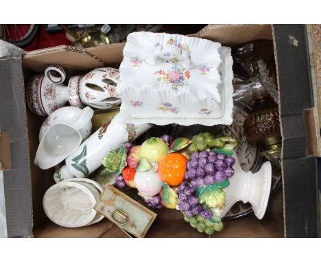 A box containing a selection of mixed domestic items to include: Portmeirion rolling pin, food moulds, fruit decorated table 