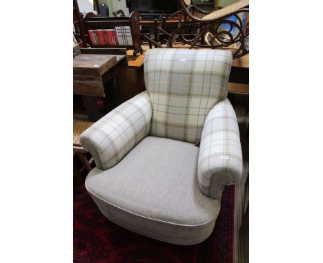 A re-upholstered first quarter 20th century club arm chair 