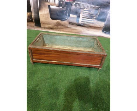 A Regency style Inlaid Mahogany Planter trough with original metal insert on shaped bun feet 65 x 35 x 21cm