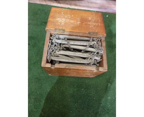A vintage escape ladder in box 38 rungs of metal on linked chain approximately 10m in length in sturdy box dimensiosn 34 x 23
