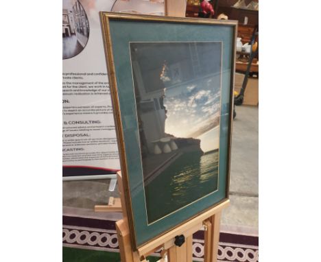 A framed modern seascape Rocks and sea landscape at Sunrise. Green border Gold frame 43 x 59cm (broken glass)