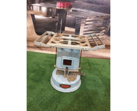 A Beatrice No.55 oil travel stove enamel cooker, paraffin driven, with circular tank at base, and tapered oval chimney, at to