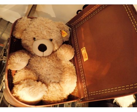 Unboxed Steiff bear in suitcase