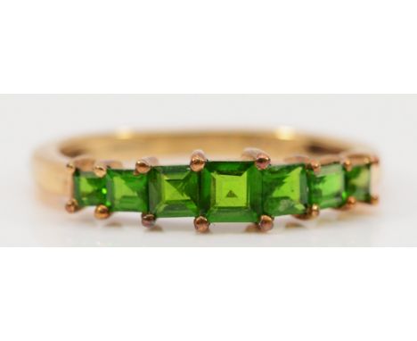 A 9ct gold diopside seven stone ring, graduating size stones, N, 1.9g