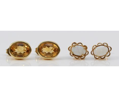 A pair of 9ct gold citrine earrings with scroll backs together with a pair of 9ct gold opal earrings with scroll backs, 2.7g