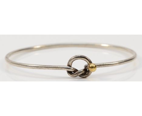 Tiffany & Co., a silver bangle with 750/18ct gold ball detail, 7gmstamped Tiffany & Co., 925 and 750, also UK hallmarked Tiff