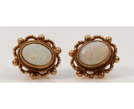 A pair of 9ct gold opal earrings with scroll backs, 2.1g