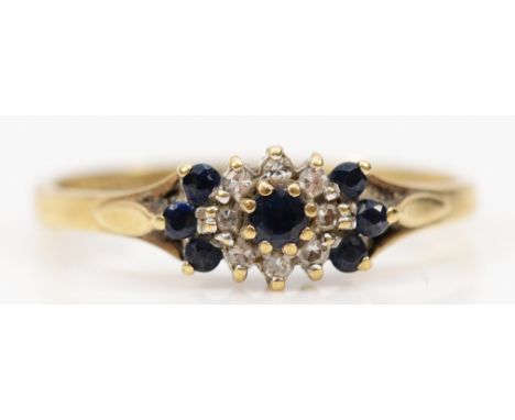 A 9ct gold diamond and sapphire cluster ring, K 1/2, 1.4g