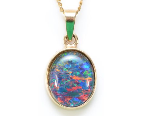 A 9ct gold opal triplet pendant with a chain, 11mm x 9mm opal, 2.5g