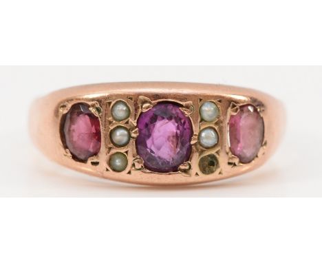 A 9ct rose gold ruby and seed pearl dress ring, K, 1.7g