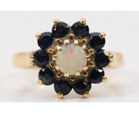 A 9ct gold opal and sapphire cluster ring, L 1/2, 3.1g