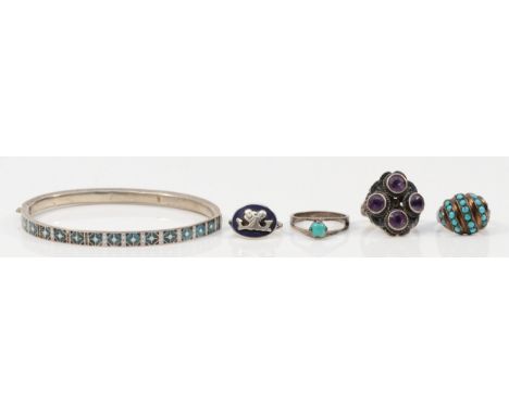 An 800 standard silver and enamel hinged bangle, 60 x 51mm, and four 925 silver rings, 26gm