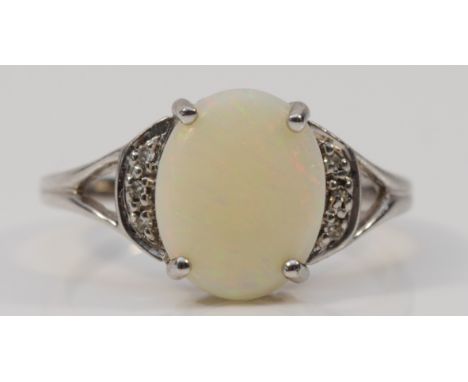 A 9ct white gold, diamond and opal dress ring, 11mm x 9mm opal, N, 2.6g