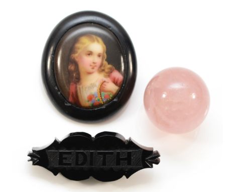 A silver mounted rose quartz ball pendant, 25mm, a Whitby Jet EDITH name brooch and a Whitby Jet and porcelain portrait brooc