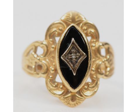 A 10k gold diamond and black onyx dress ring, band misshapen, K, 2.7g
