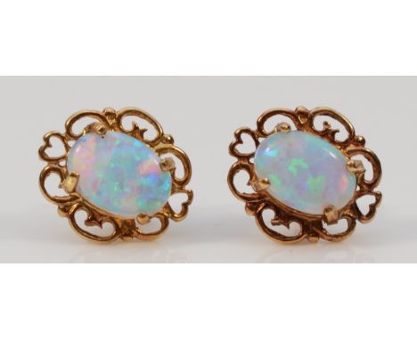 A pair of 9ct gold opal earrings with scroll backs, 0.9g