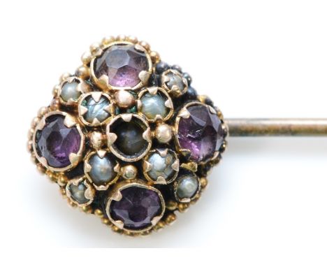 An unmarked 9ct gold amethyst and seed pearl stick pin, 65mm length, 1.5g