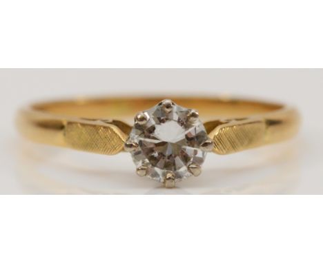 An 18ct gold and single brilliant cut diamond ring, approximately 0.60cts, J/K, Si1/2, R, 2.8gm, nibbles to the girdle